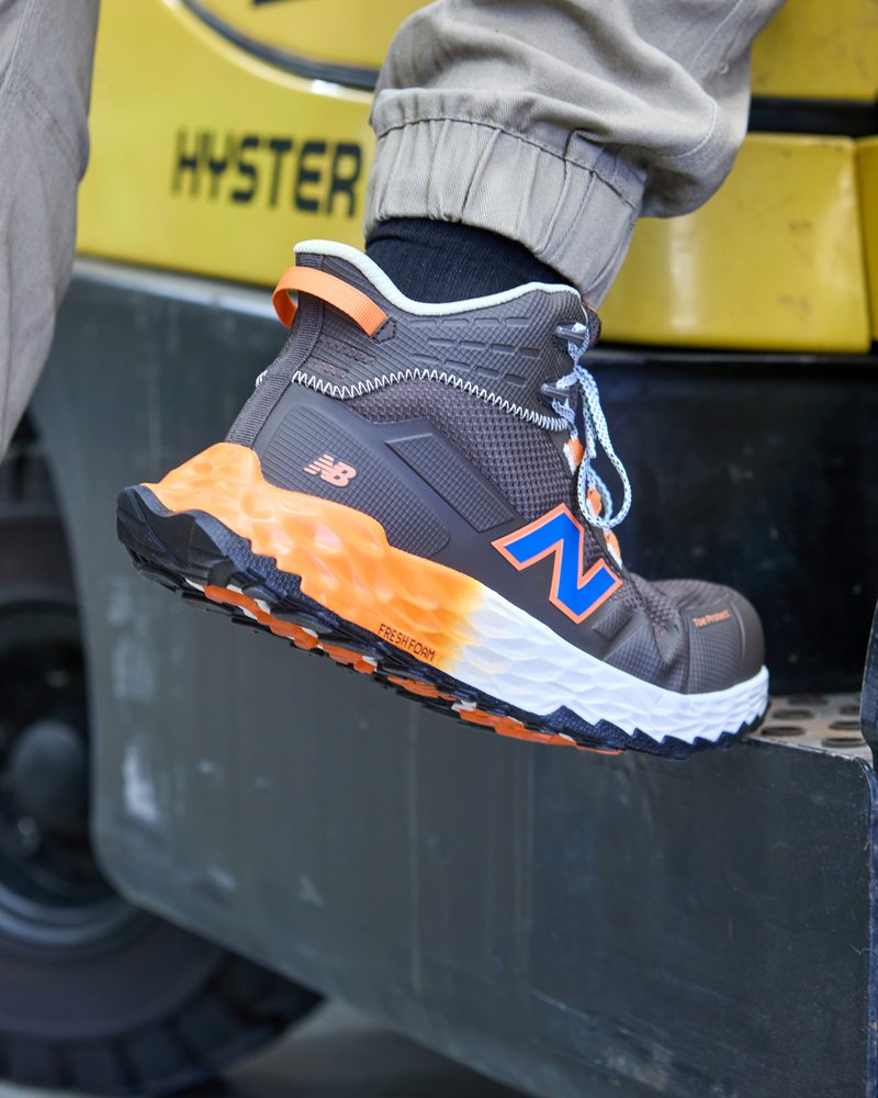 New Balance Fresh Foam Cremorne Mid safety shoe on a forklift step
